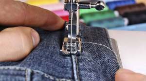 close up of sewing machine and fabri