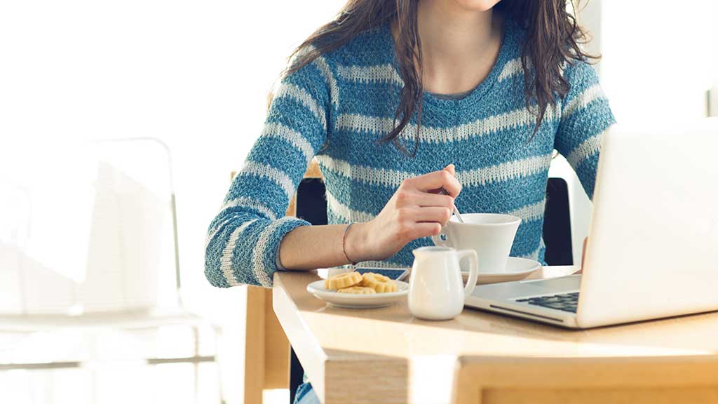 woman at work breakfast biscuit