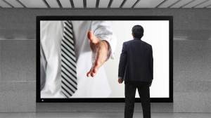 salesperson reaching out of tv