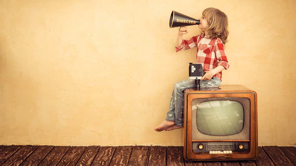 boy on retro tv with megahone and video camera