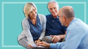 senior couple speaking with financial planner