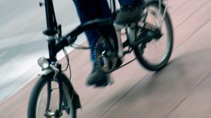 person riding folding bike