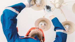 Electrician fixing light call out service lead