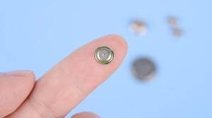 button battery on a finger