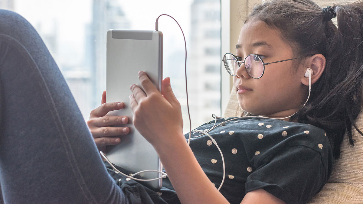 child looking at tablet