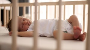 baby sleeping in cot