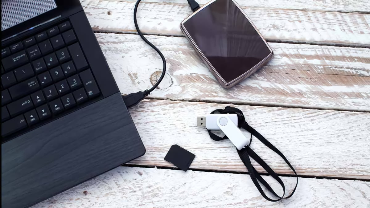 storage drives and laptop on table new