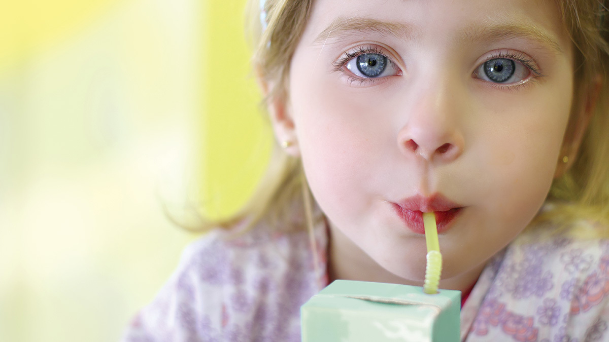 young_girl_drinking_popper_fruit_juice_drink
