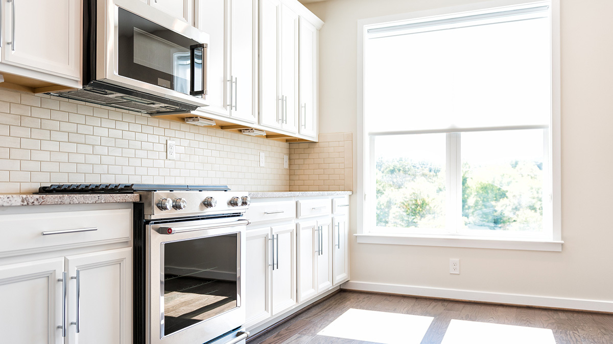 lead kitchen with oven and microwave
