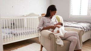 woman sitting in nursery at home