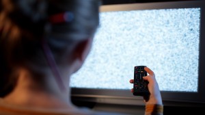 person looking at faulty tv