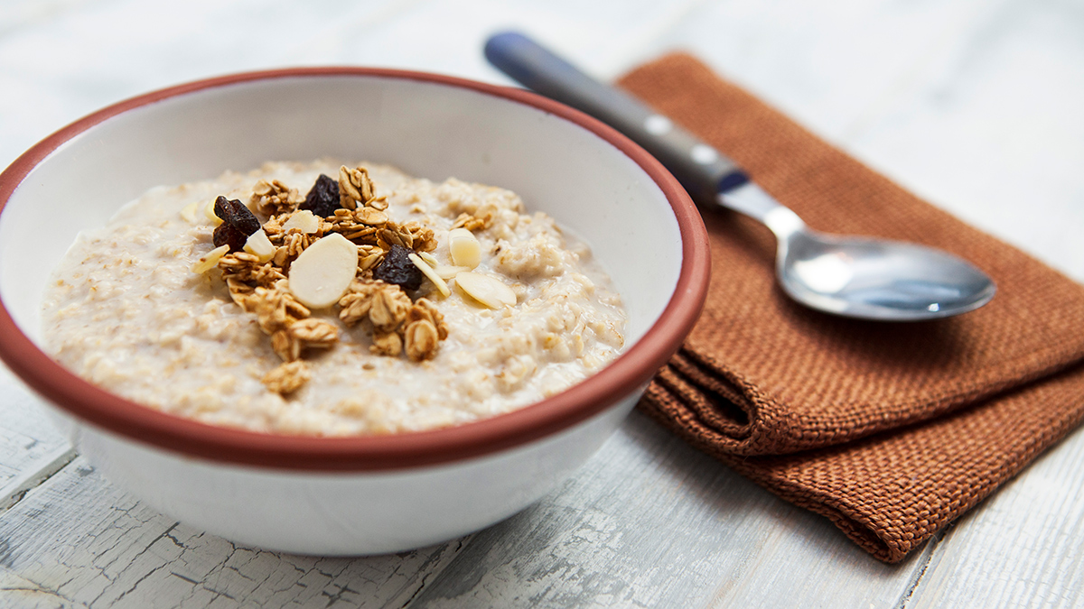 porridge oats in a bowl with a spoon and napkin