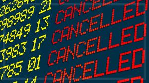 cancelled flights on an airport departures board