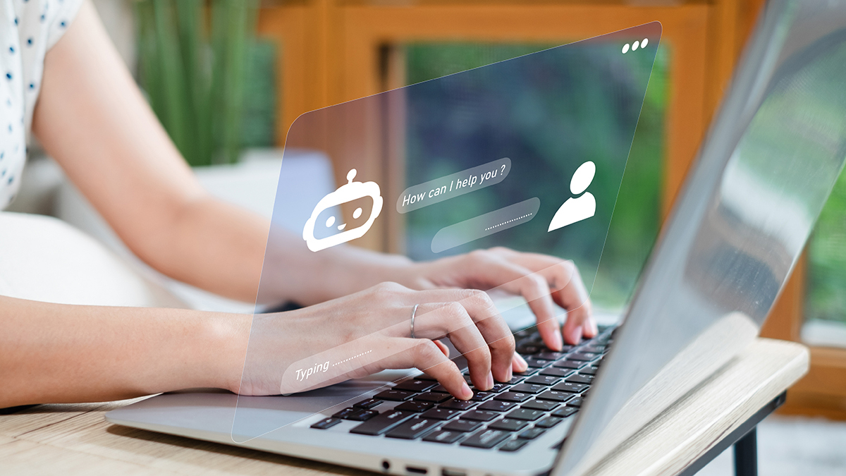 person messaging chatbot on laptop