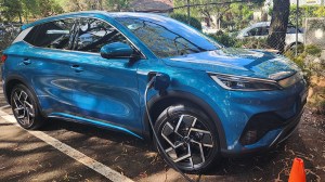 Blue BYD Atto 3 charging in choice car park