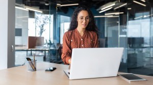 woman working on laptop ai regulation