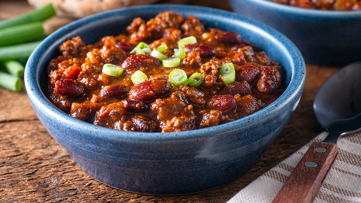 chilli shredded beef with beans in a blue bowl