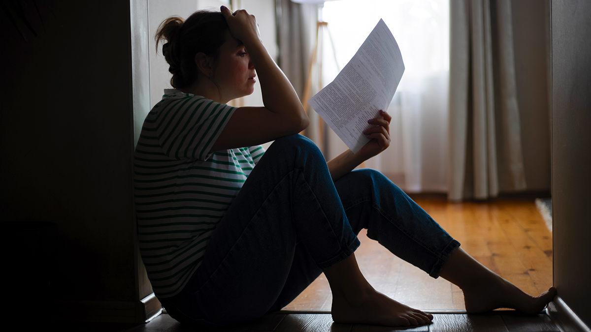 distressed_tenant_reading_eviction_notice