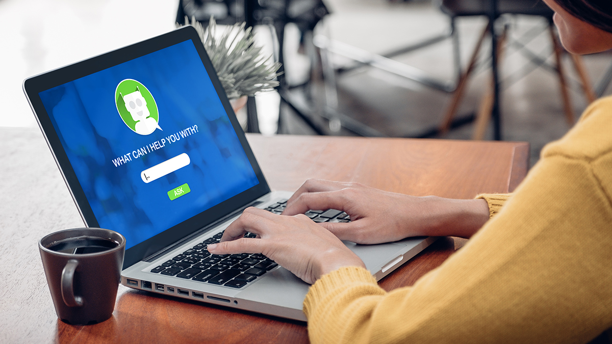 person using chatbot on laptop
