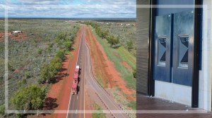 composite shot of road train on the stuart highway and anz atms