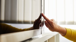 A person using an inverter microwave at home