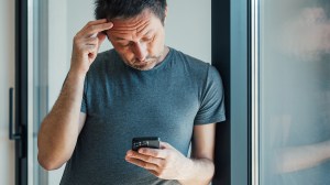 frustrated person on smartphone
