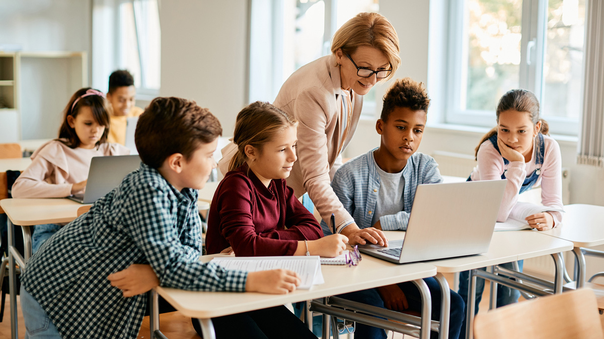 students working on laptop