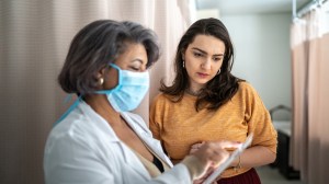 young_woman_talking_to_health_professional